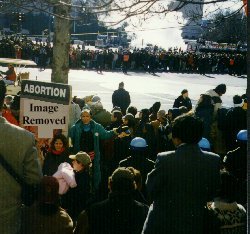 A shot of anti-abortion protesters and DC police along the parade route